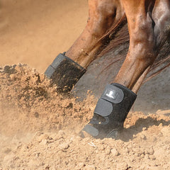 Classic Equine neoprene skid boots black close-up showing secure closure and fit.
