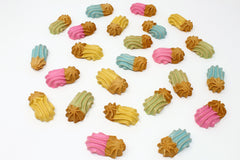 Claudia's Canine Goobers half-dipped pastel closeup showing colorful rewards during training.