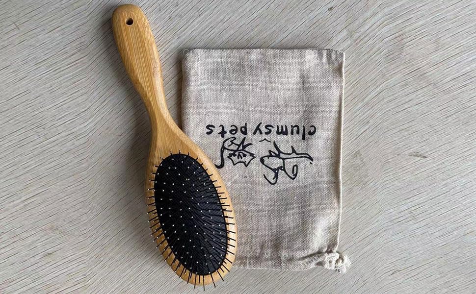 Clumsy Pets ball pin slicker brush stainless steel pins for detangling efficiency.