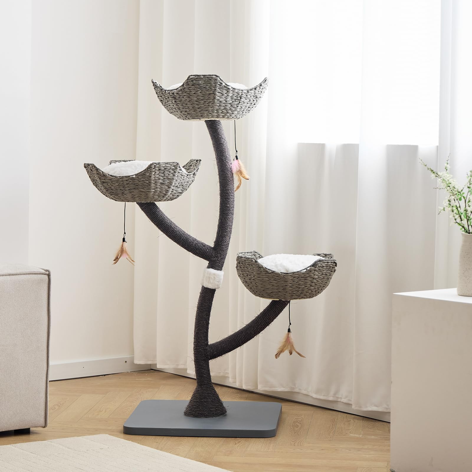 CLVTREBETO cat tree includes feather toy refills to boost enrichment.