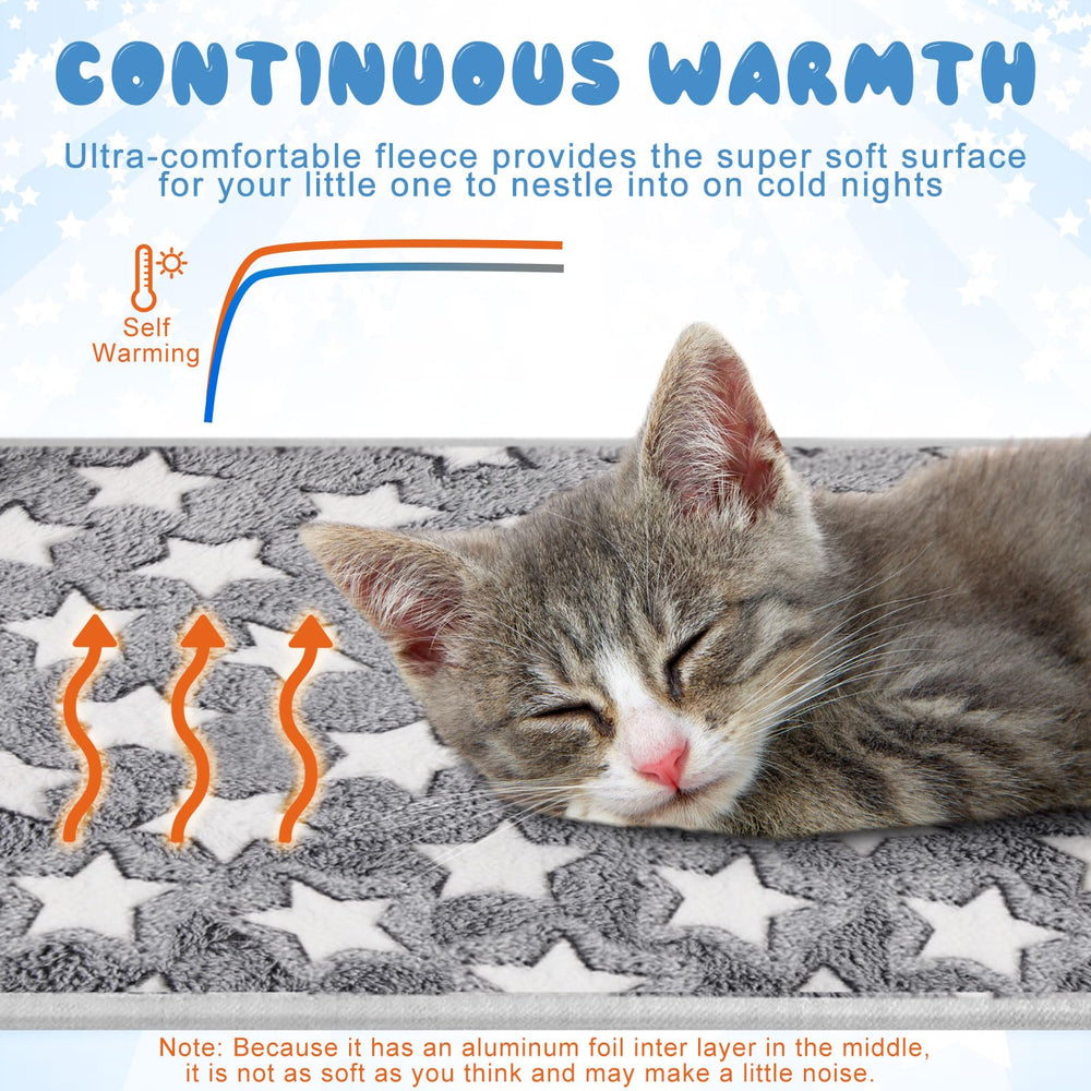 Clysee self warming cat pad with pet resting on it in crate