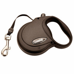 Coastal Power Walker retractable leash extended in park for balanced dog freedom and control.