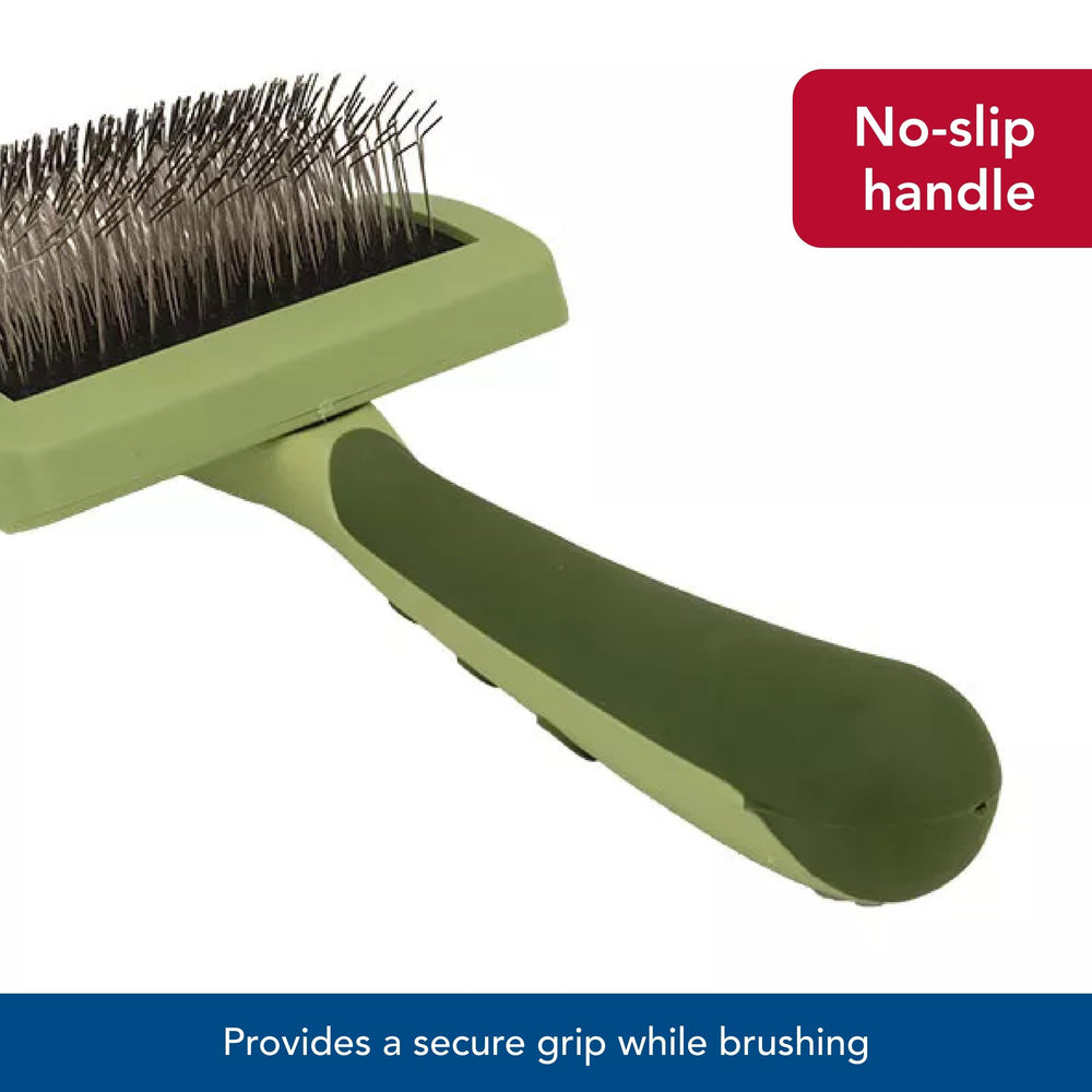 Coastal Safari brush in use on a long-haired dog shows practical grooming benefits
