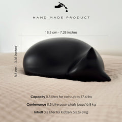 Comemori sleeping cat urn black top view, compact keepsake design