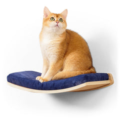 COOLEX curved cat shelf with cushion for secure resting on a floating wall bed.