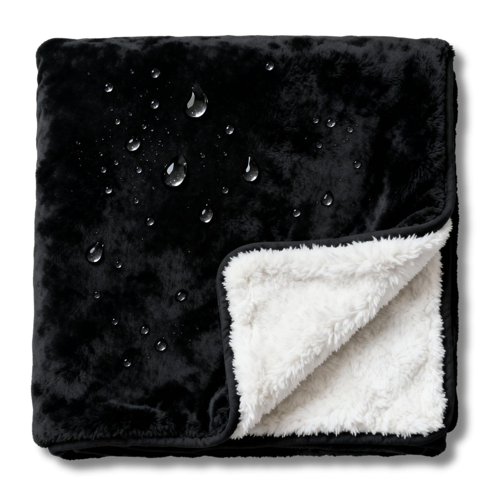 CREW FLX bed blanket demonstrates waterproof protection for spills during sleep.