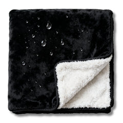 CREW FLX bed blanket demonstrates waterproof protection for spills during sleep.