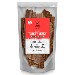 Cure for the Crave Canine Cravers turkey jerky packaging close-up emphasizes air-dried, all-natural ingredients.