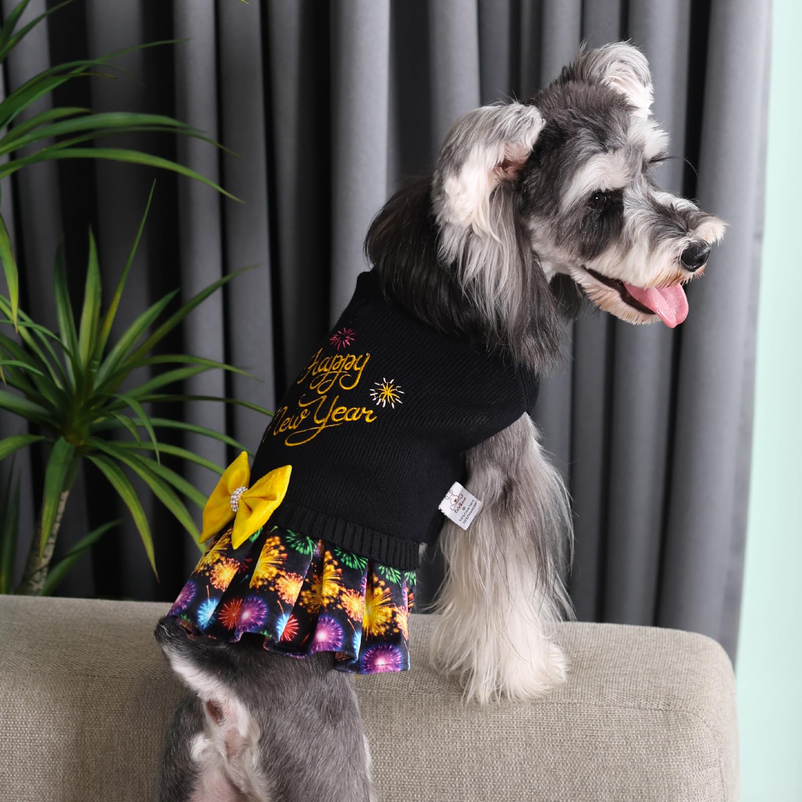 CuteBone Core Spun Happy New Year dog sweater dress bowtie-detail highlights cute style for photos.