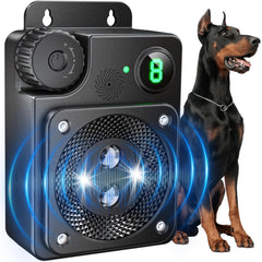 Cuukiee ultrasonic dog bark deterrent with 50ft range mounted on a fence for yard control.