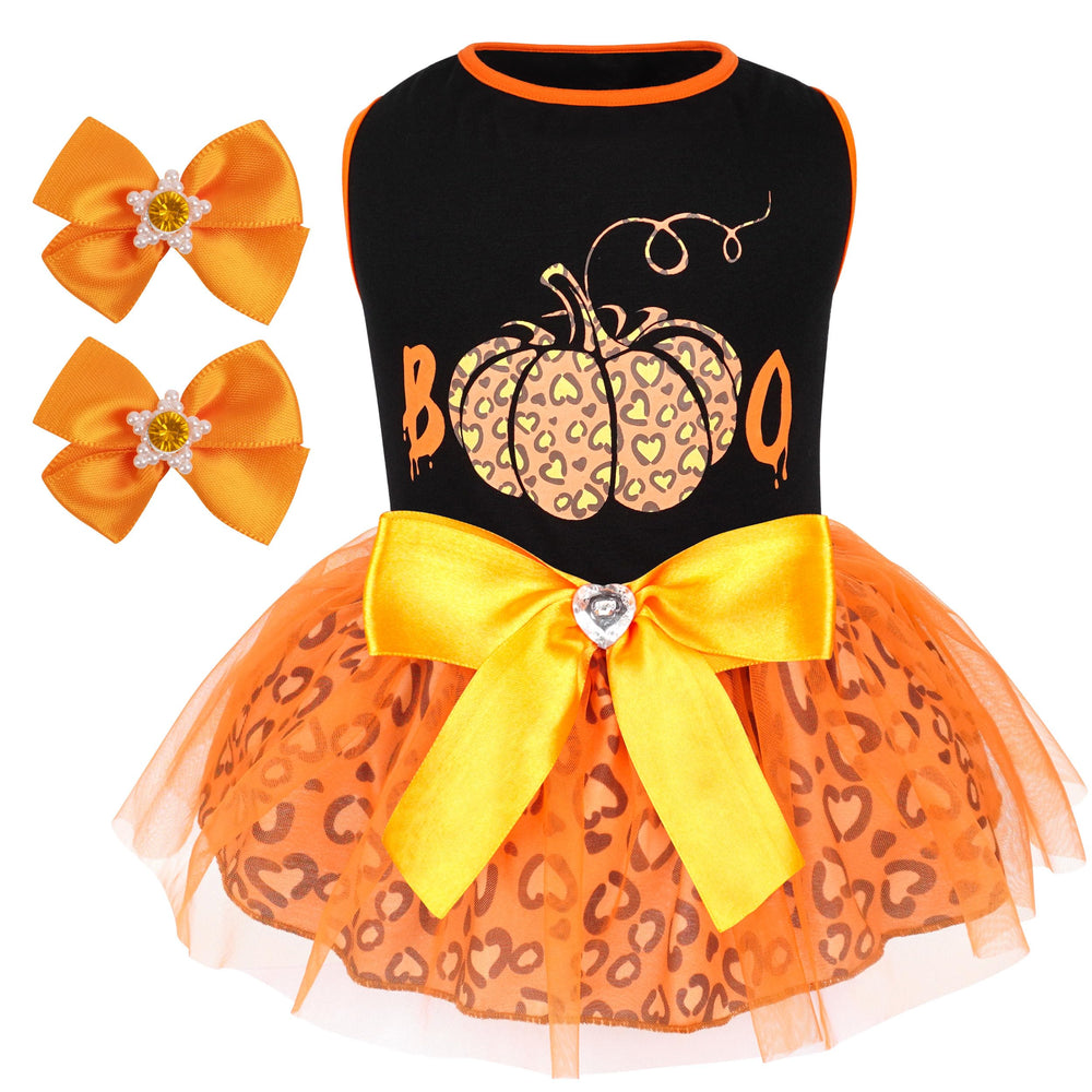 Cyeollo dog dress on model shows plaid with gold bow for holiday style.