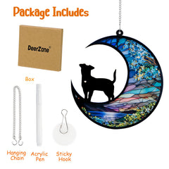 DeerZone dog memorial suncatcher hanging in a sunny window with warm glow