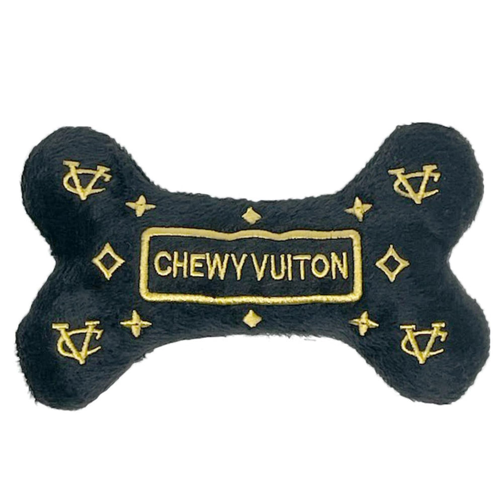 Dog Diggin Designs Runway Pup bone toy with bold colors and squeaker for interactive play.