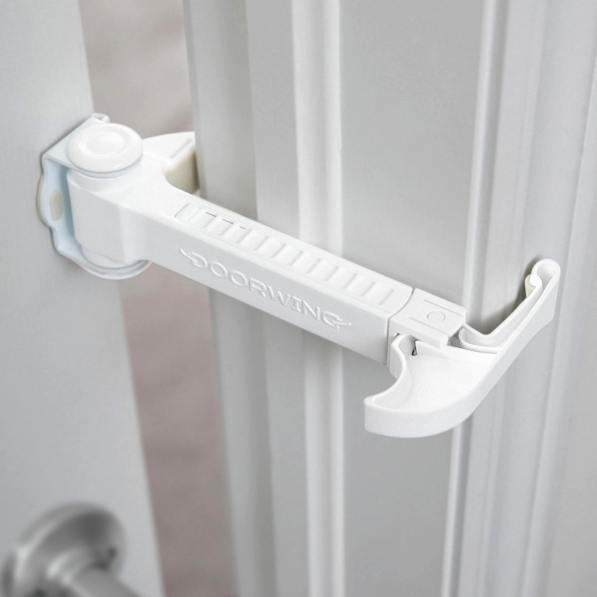 DOORWING portable door lock in use with easy, non-destructive setup.