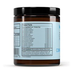 Dr. Mercola Bark & Whiskers probiotic scoop sprinkled over food for daily gut support.