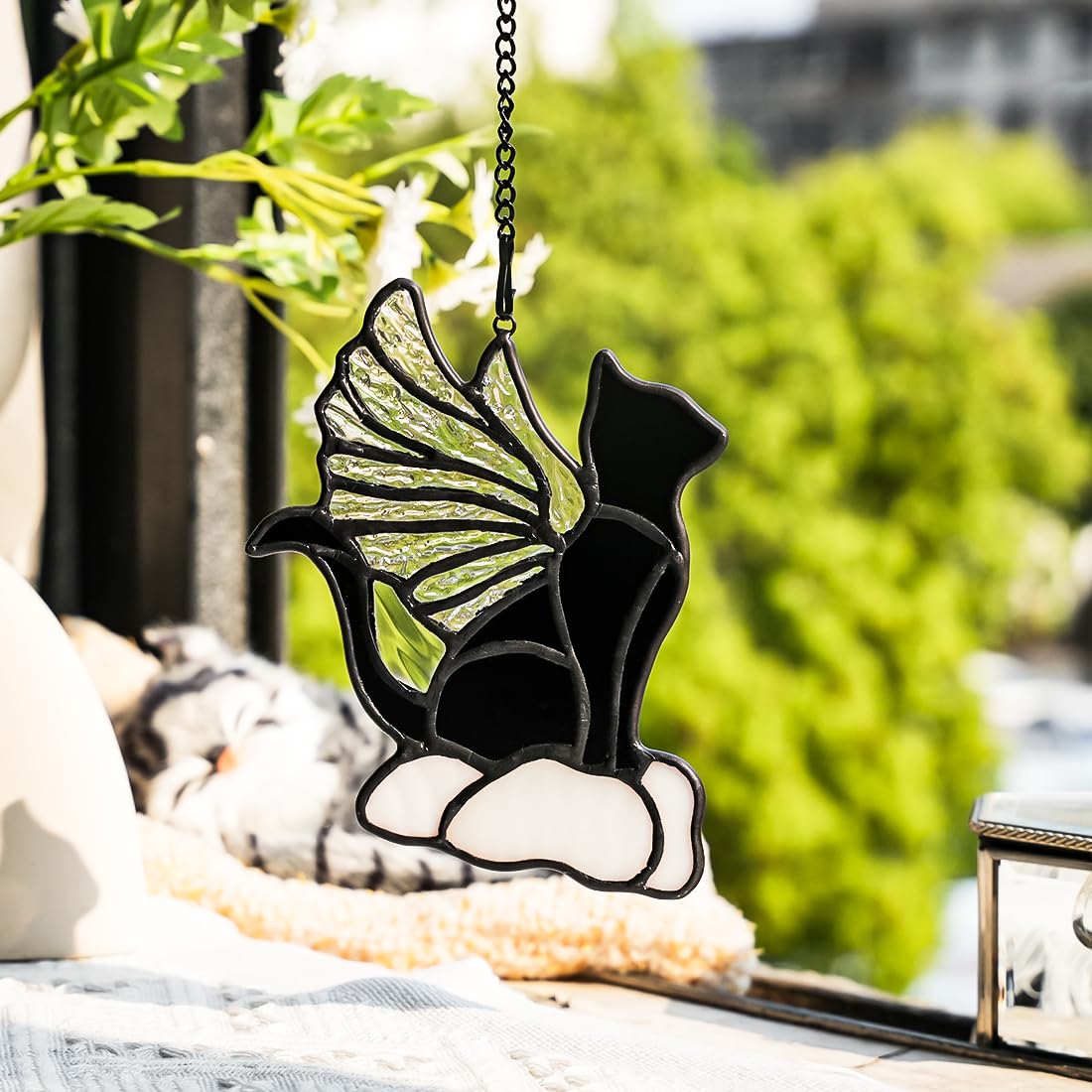 EPOGIFTS angel wings iridescent cat adds radiant glow to windows.