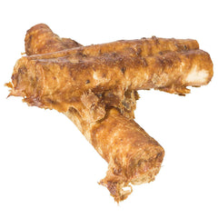 Fieldcrest Farms Nothing to Hide Rolls dog chewing action illustrating safe rawhide substitute.