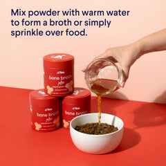 Finn Bone Broth Plus bottle being poured over dog food for flavor