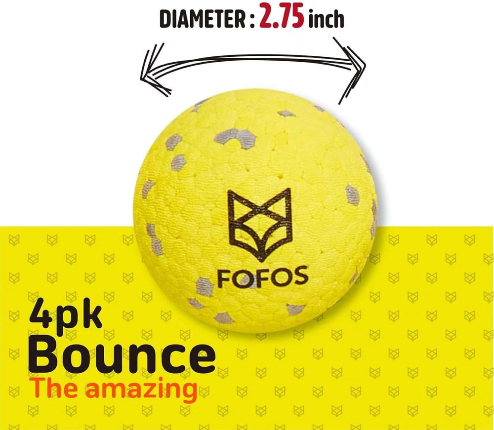 FOFOS dog balls four-pack on grass ready for fetch.