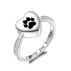 Fookduoduo paw-print urn ring closeup with black enamel, lasting memorial