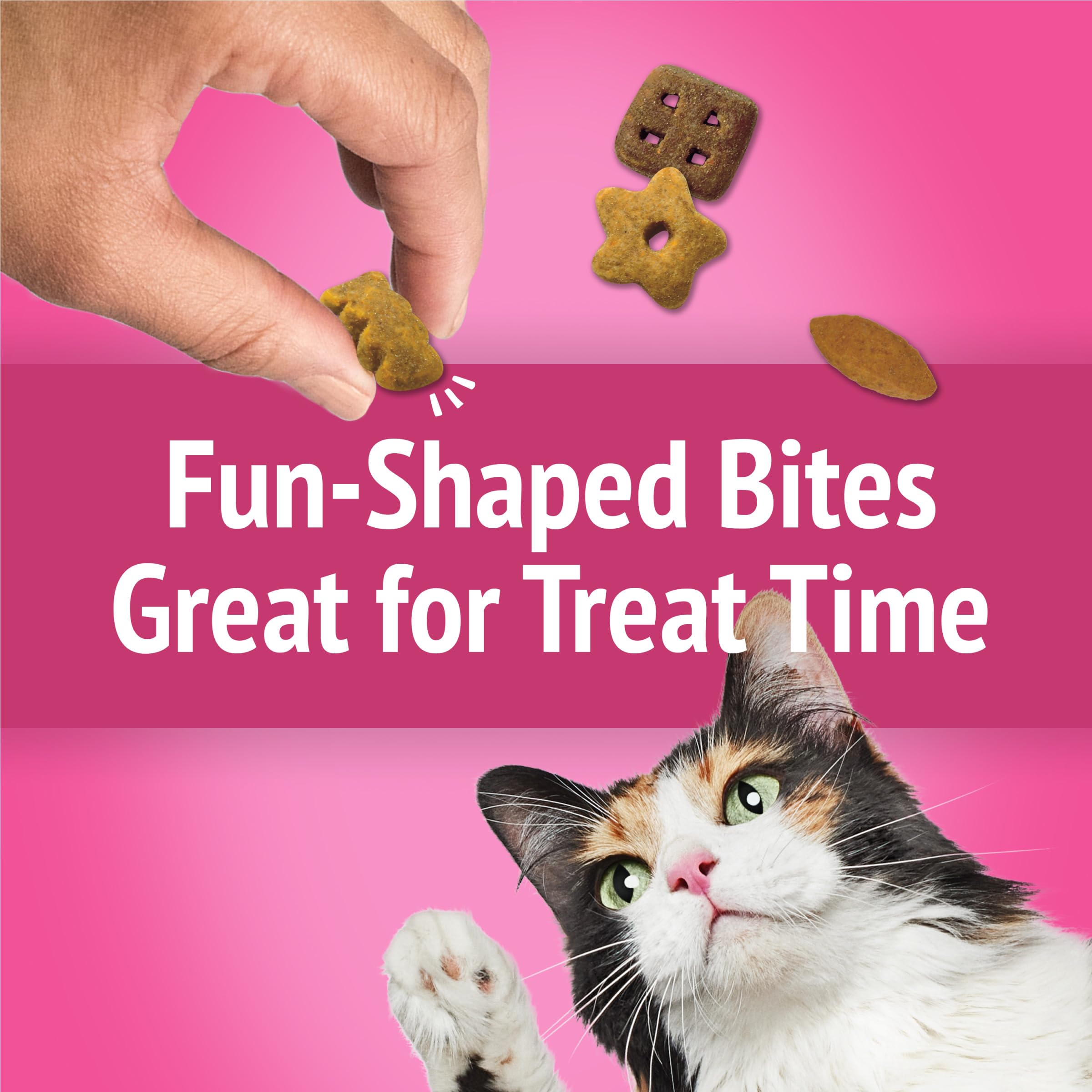 Friskies cat enjoying California Crunch treats with contented purr.