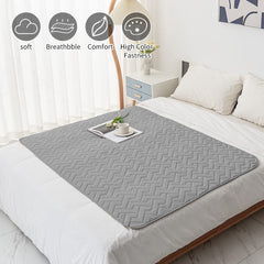 Fuguitex waterproof dog bed cover on sofa shows protection against spills.
