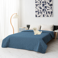 Fuguitex waterproof dog bed cover on sofa protects furniture from spills.