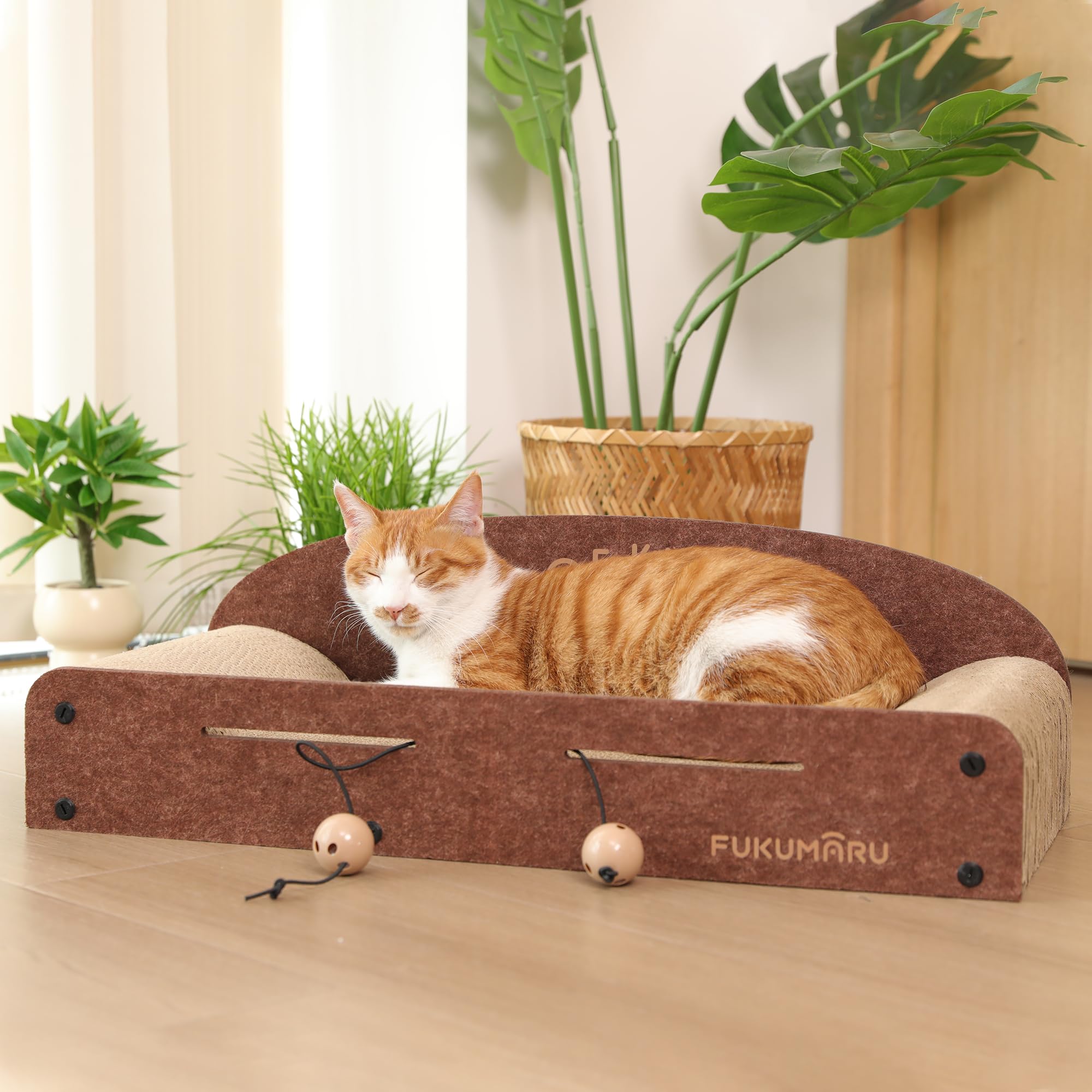 FUKUMARU cat scratcher lounge bed with bell balls offers playful energy release.