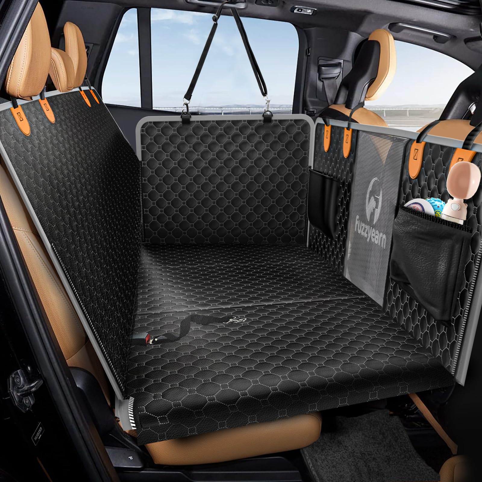 Fuzzyearn leather back seat extender installed with expanded space for dogs on trips.
