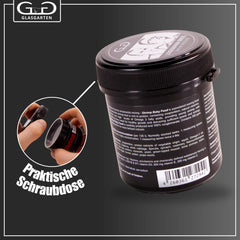 Detail of GlasGarten Shrimp Baby Food powder granules forming a film in water.
