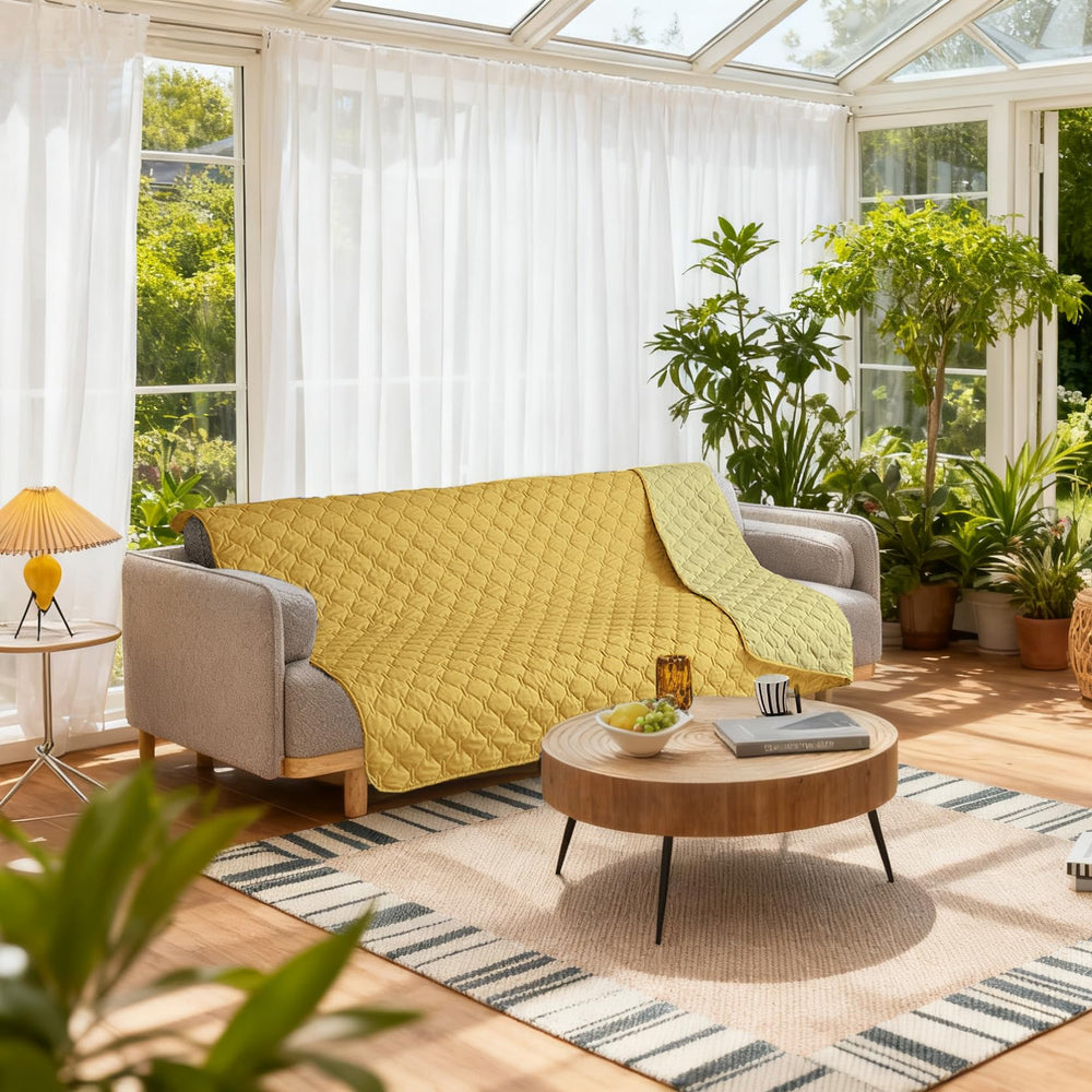 Gogobunny sofa protector on couch demonstrates durable fabric with easy care.