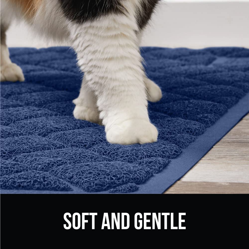 GORILLA GRIP cat litter box mat being shaken out for quick cleanup