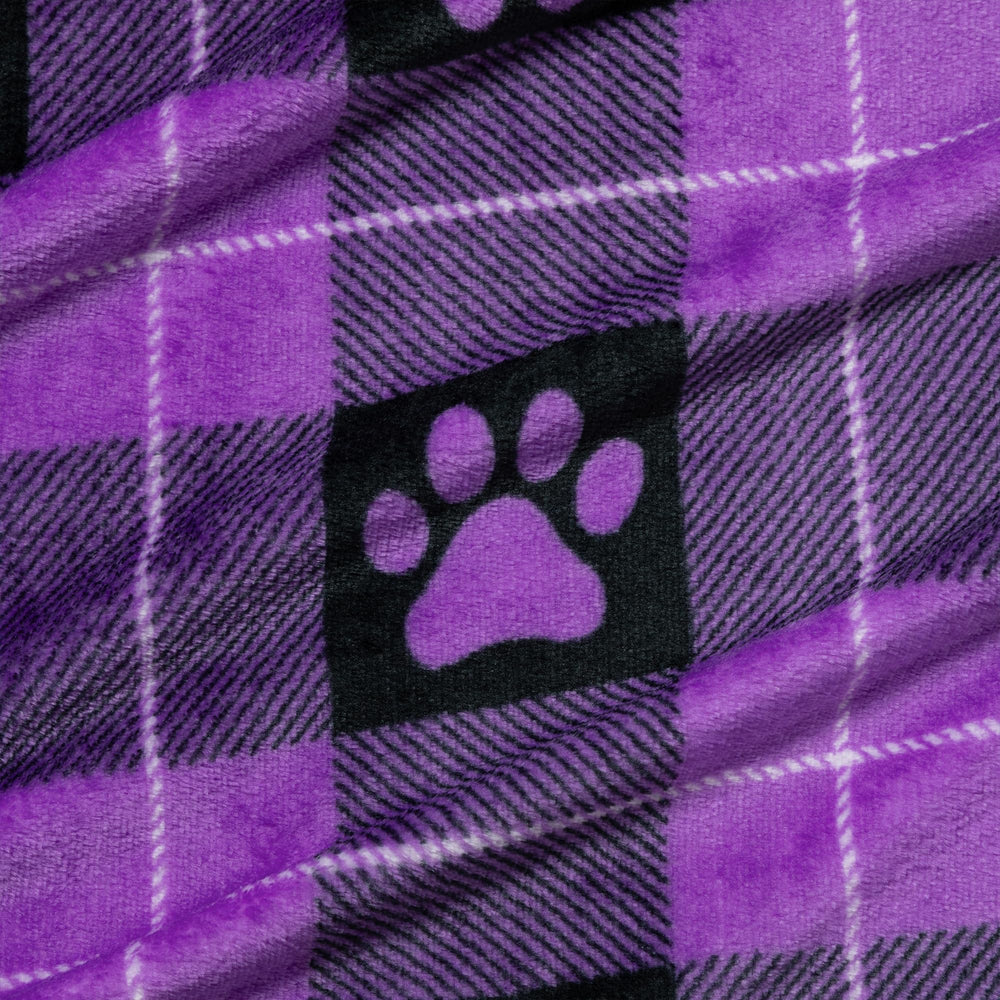 GreaterGood paw-print purple crate-use blanket creates a familiar, comforting space in a crate.