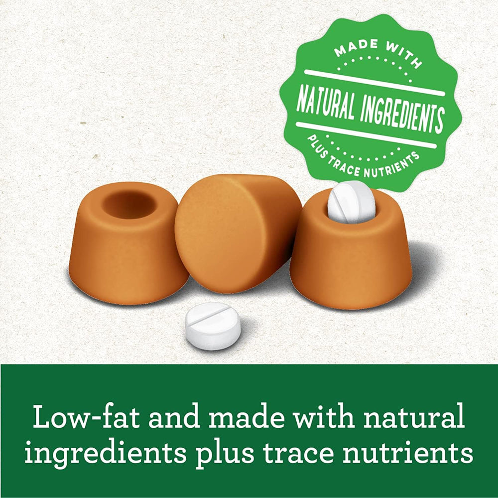 Greenies Pill Pockets dog eating treat image suggests stress-free tablet feeding.