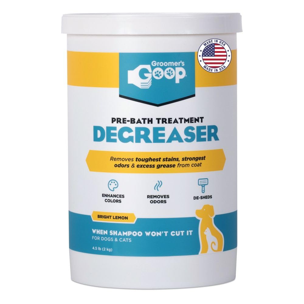 Groomer's GOOP pre-bath degreaser bottle being poured for deep grease removal