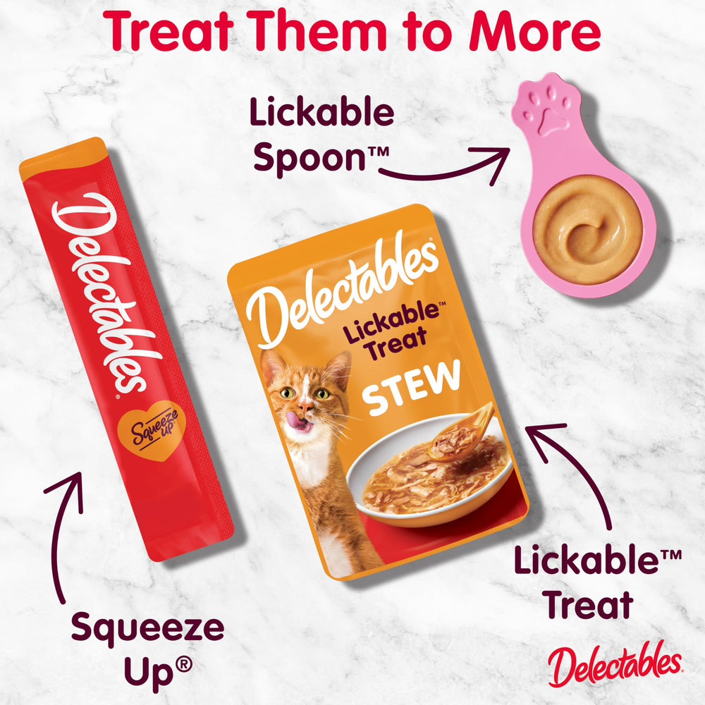 Hartz Delectables Squeeze Up cat enjoying treat during playtime