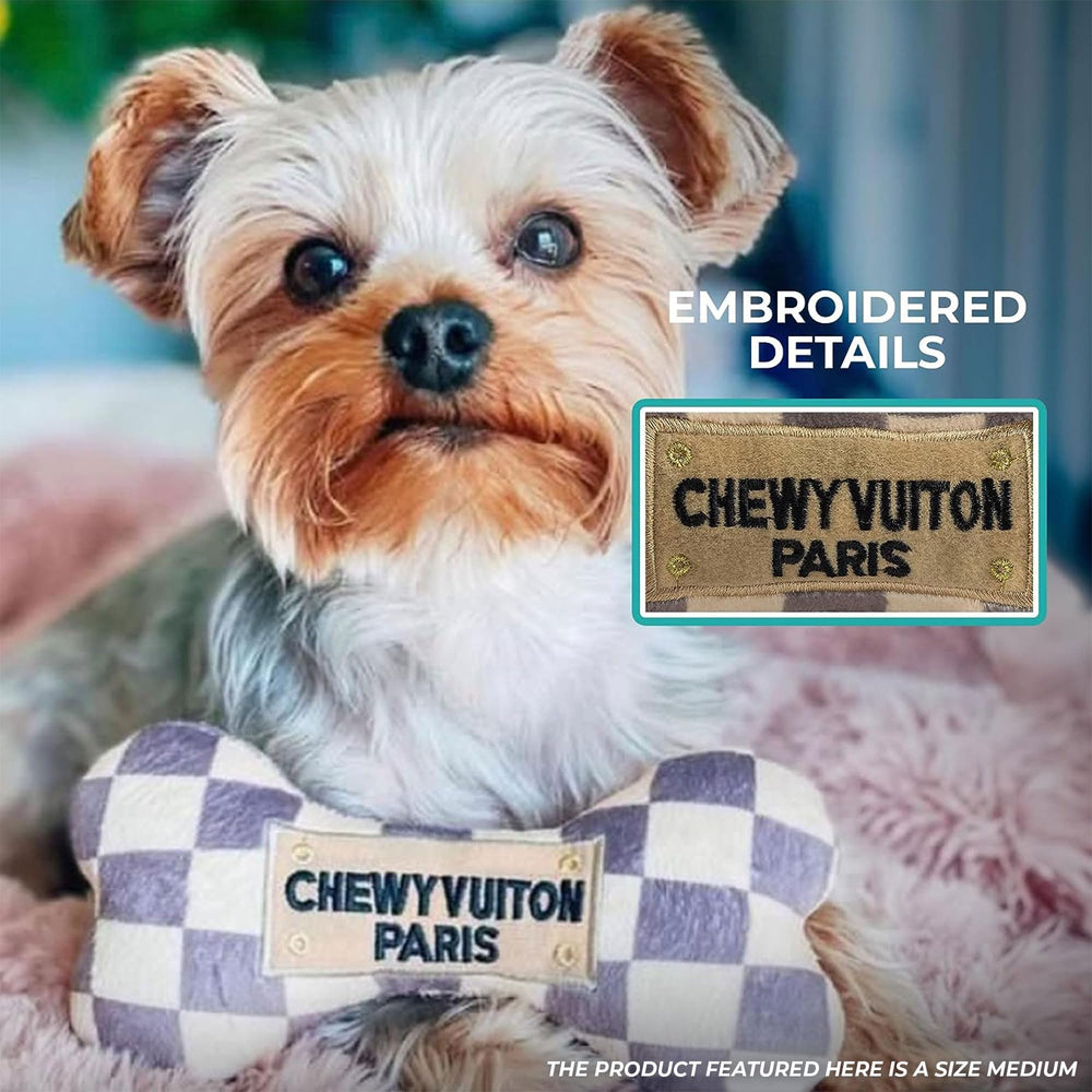 Checker Chewy Vuiton Bone in action during dog play for engagement.