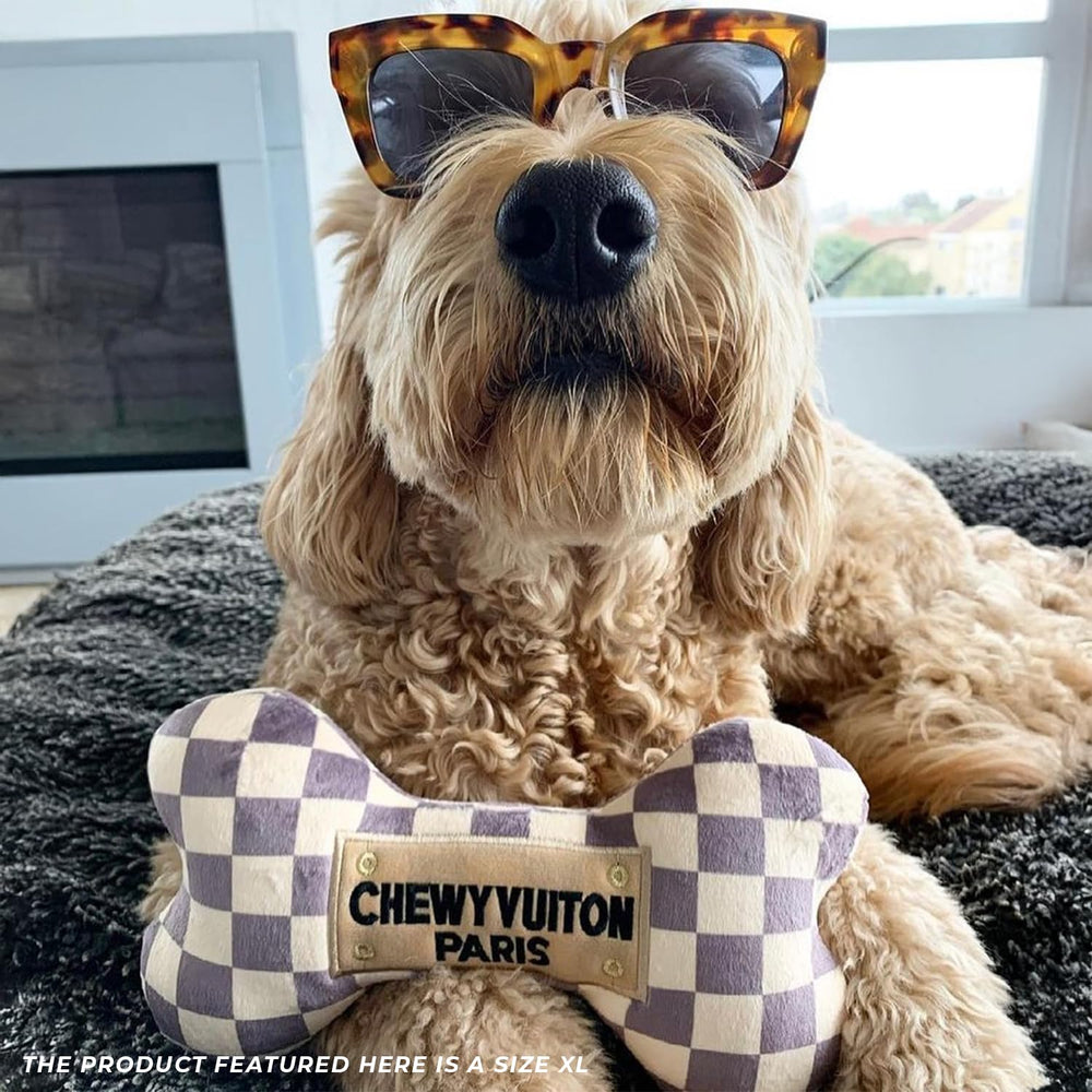 Haute Diggity Dog Checker Chewy Vuiton Bone XL scale demonstrates size for aggressive chewers.
