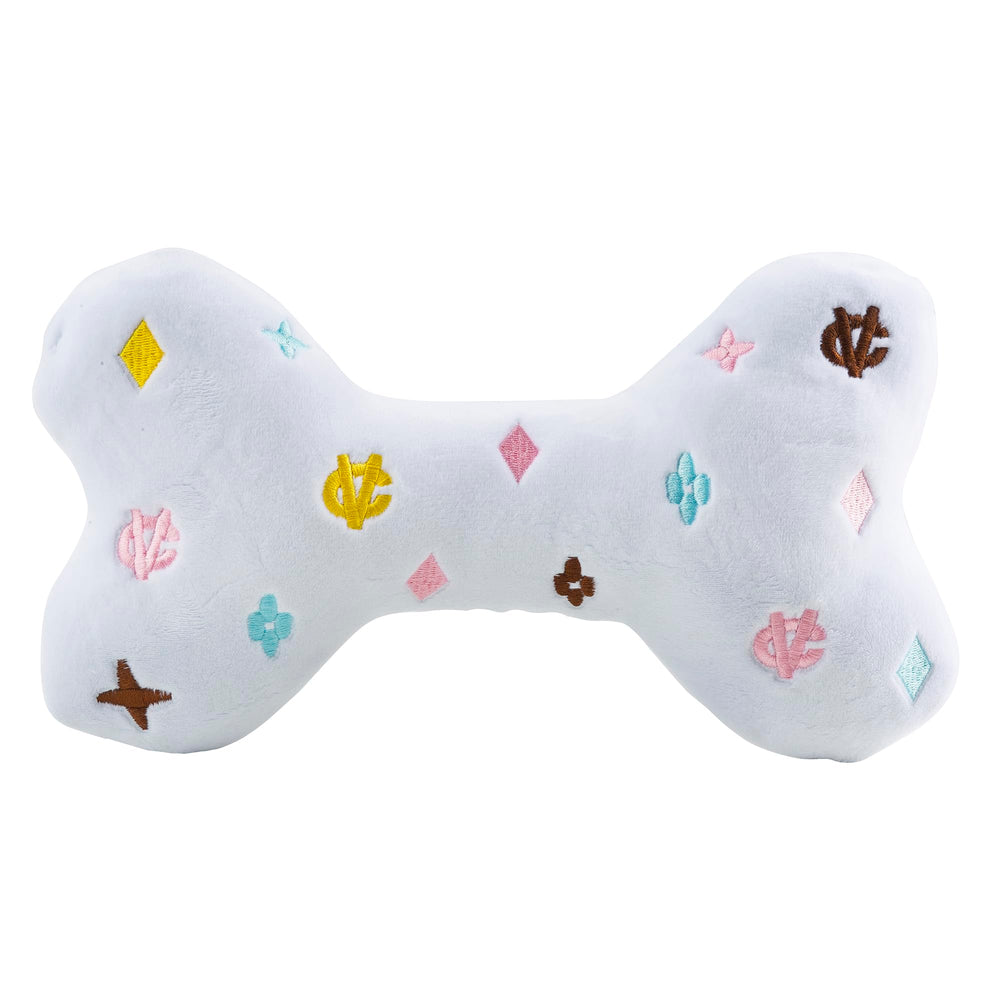 Haute Diggity Dog White Chewy Vuiton Bone inner-squeaker keeps dogs engaged during fetch.