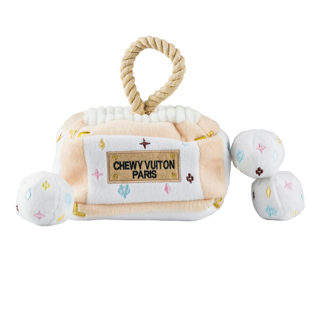 Haute Diggity Dog White Chewy Vuiton trunk demonstrates stylish, interactive play for enrichment.