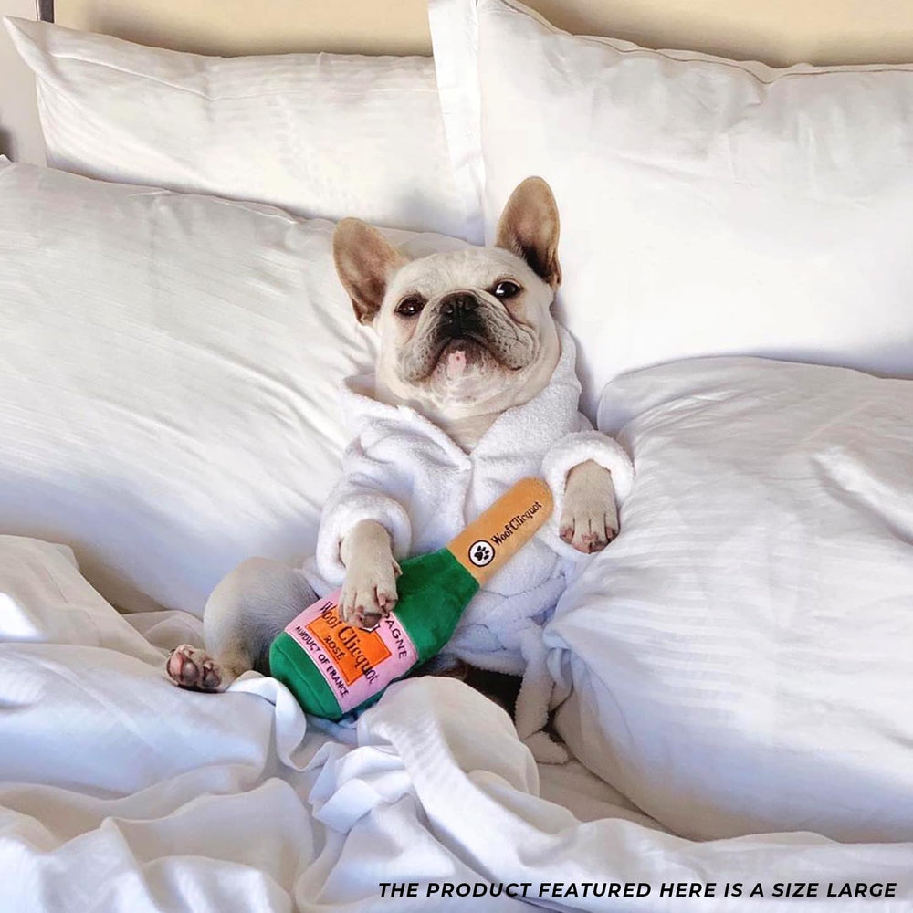 Haute Diggity Dog Woof Clicquot Rose' toy in use during cuddle and play.