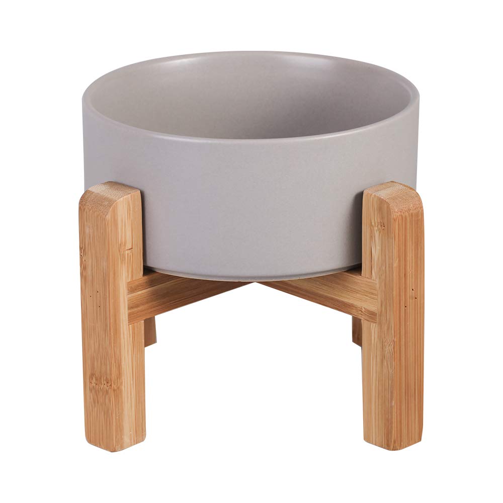 HCHLQLZ ceramic elevated cat bowl on wood stand promotes comfortable feeding posture.