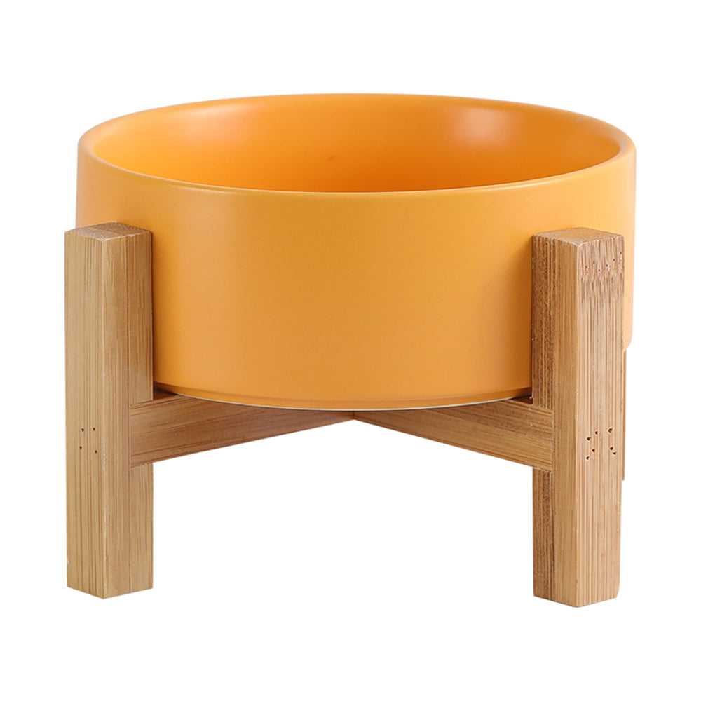 HCHLQLZ elevated ceramic cat bowl in yellow with stable stand for comfortable feeding.