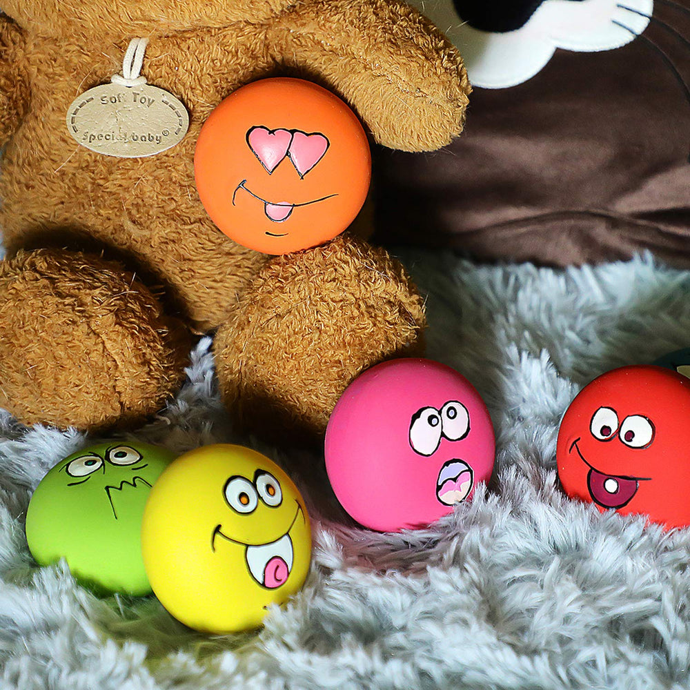 HDSX Smile Face latex toy closeup shows soft squeak and non-toxic material.