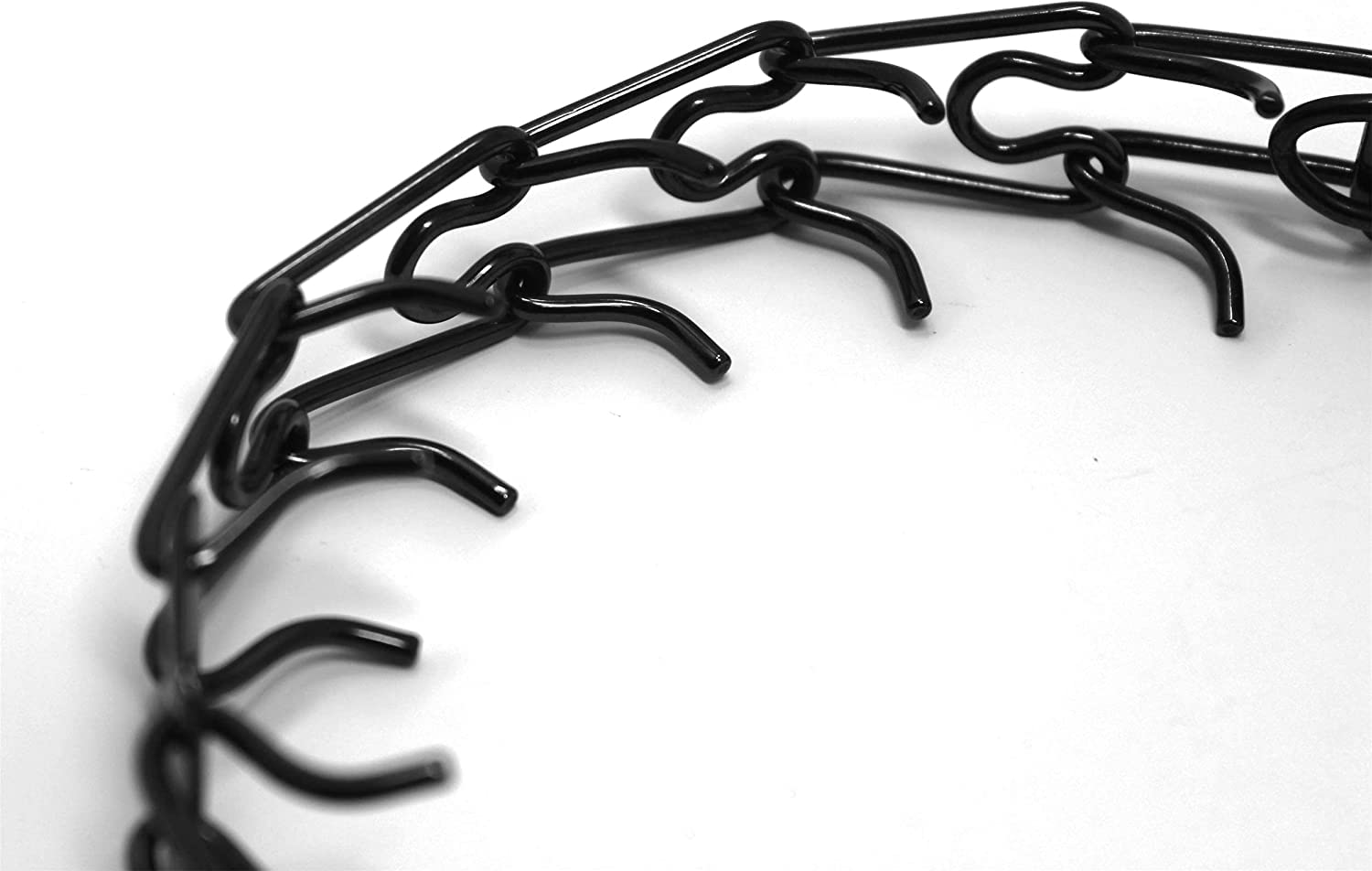 Herm Sprenger interlocking links with blunt prongs reduce pinch pressure while teaching cues.