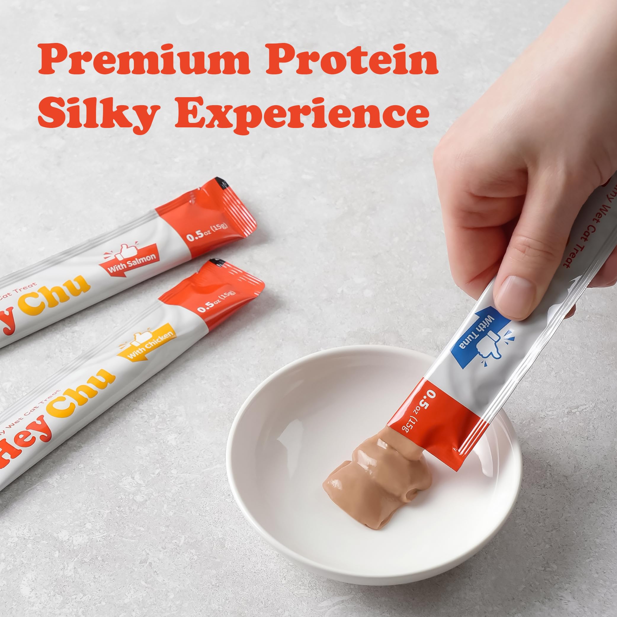 Hey Chu Squeezable Treats salmon tube close-up emphasizes creamy texture.