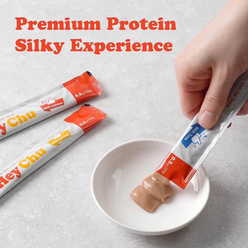 Hey Chu Squeezable Treats salmon tube close-up emphasizes creamy texture.