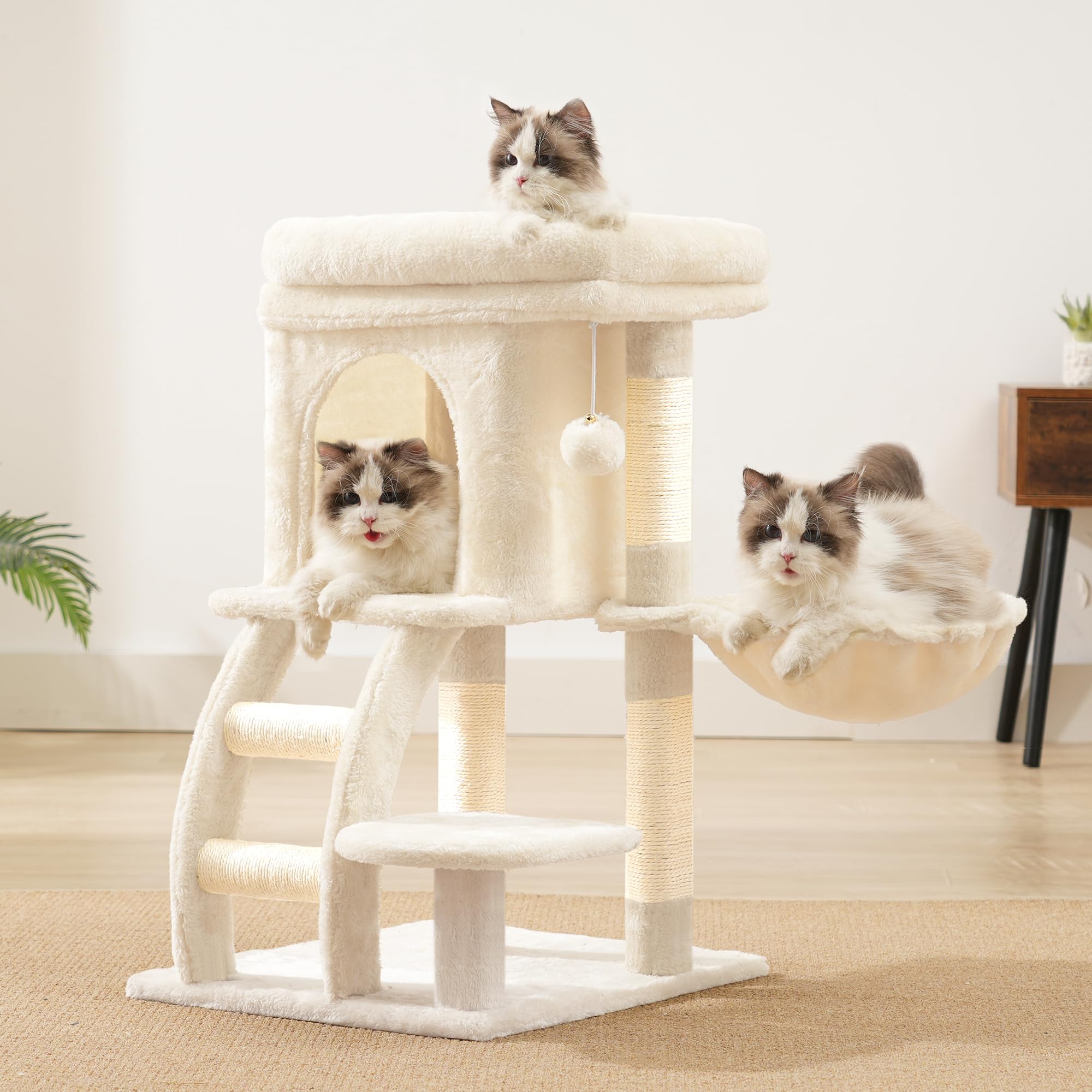 Heybly cat tree tower in-room view demonstrates compact footprint for apartment living.