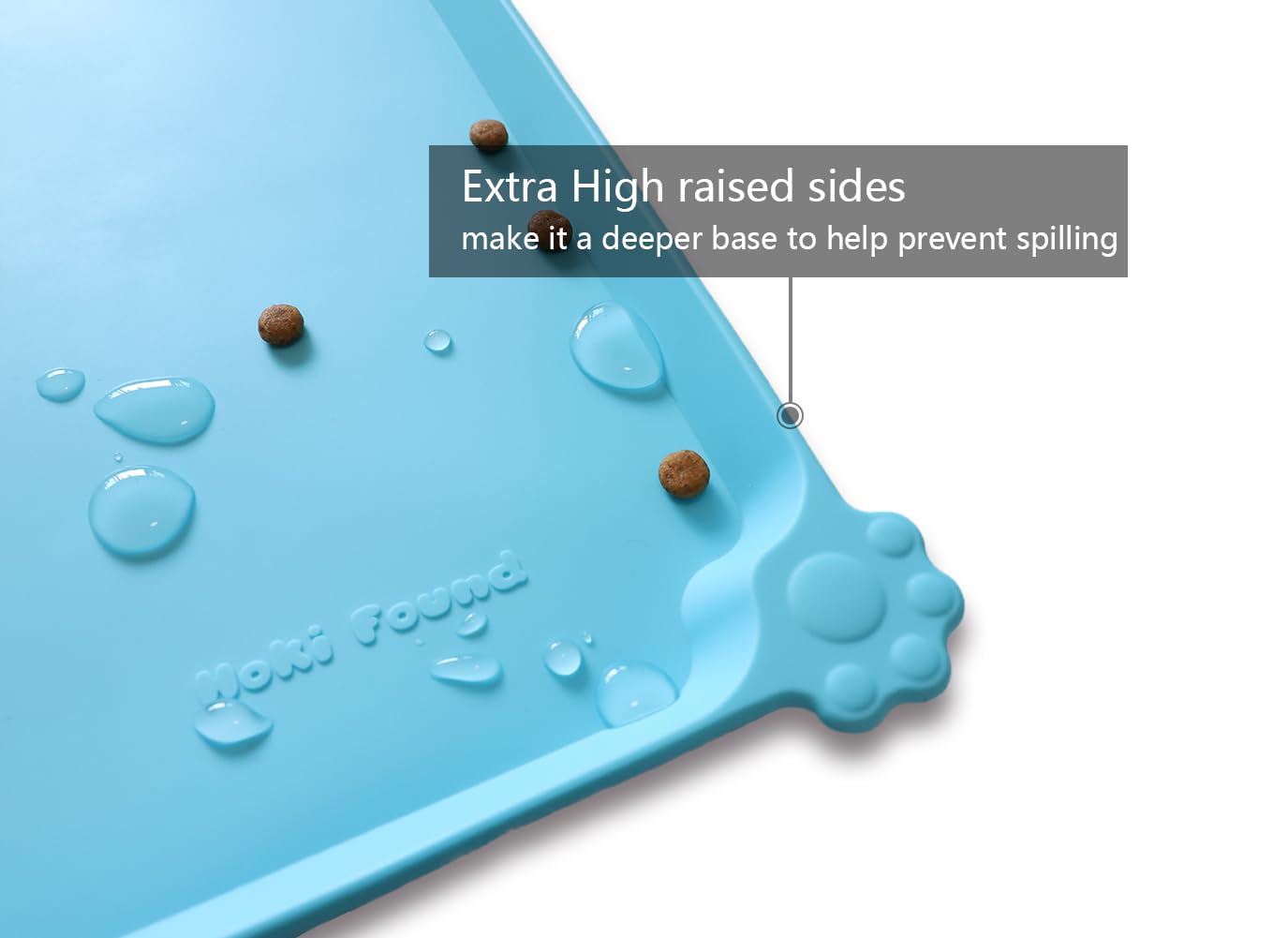 Hoki Found extra-high edge mat contains water and crumbs for easy cleanup.