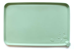 Hoki Found L silicone non-slip pet bowl mat in jade keeps feeding area clean.